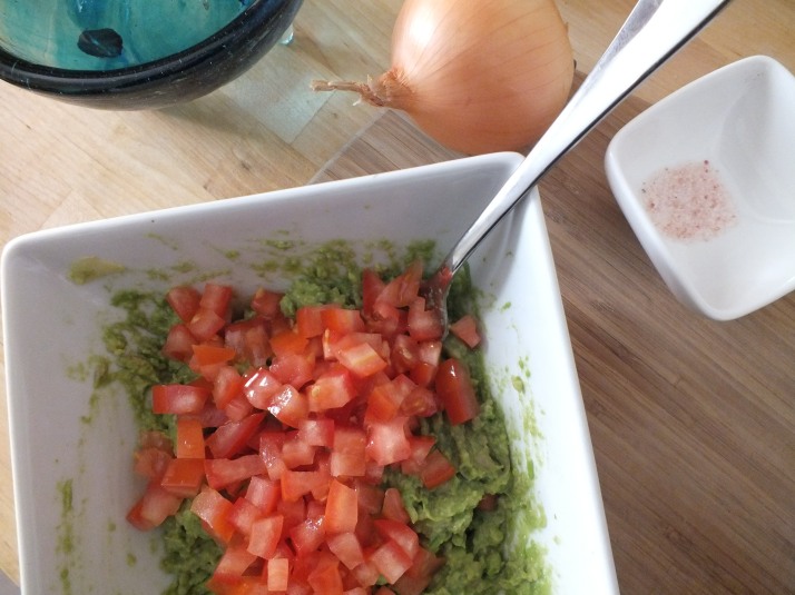  Guacamole and Tomatoes in Bowl with Spoon