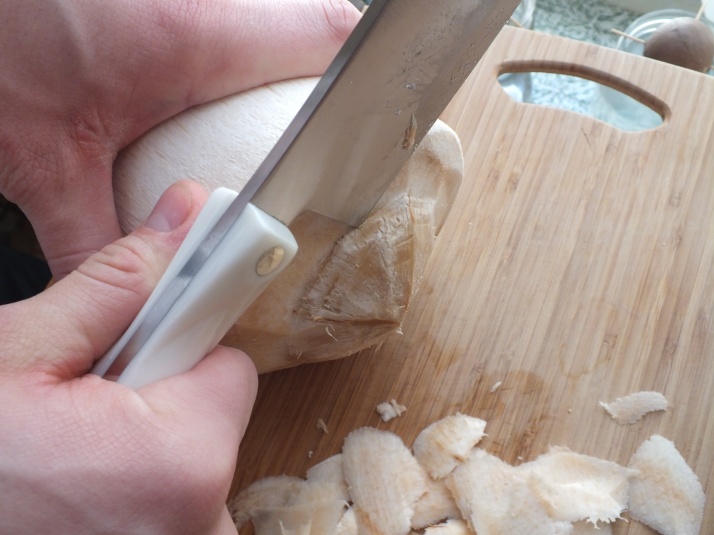 Knife Cutting Coconut